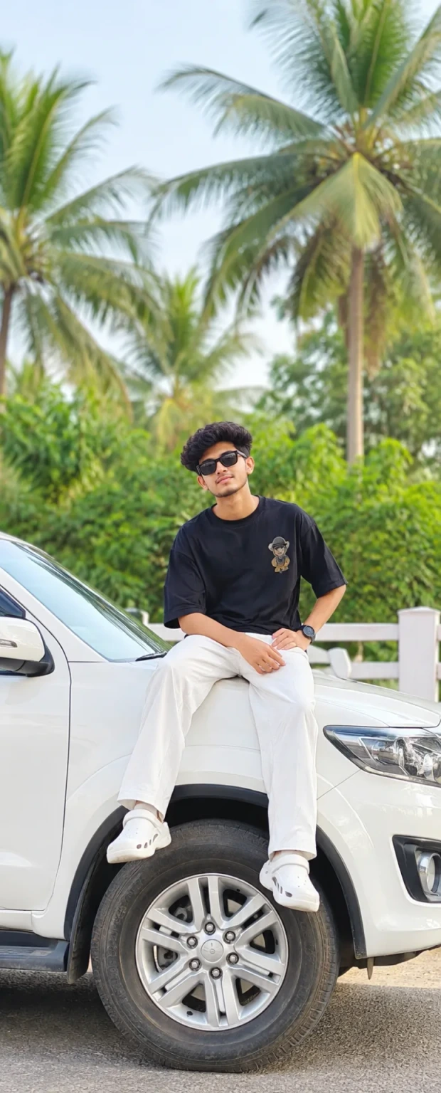 😎 Casual Streetwear Portrait of a Young Man Sitting on a White SUV in a Lush Green Palm Setting 🌴 #CinematicPortrait