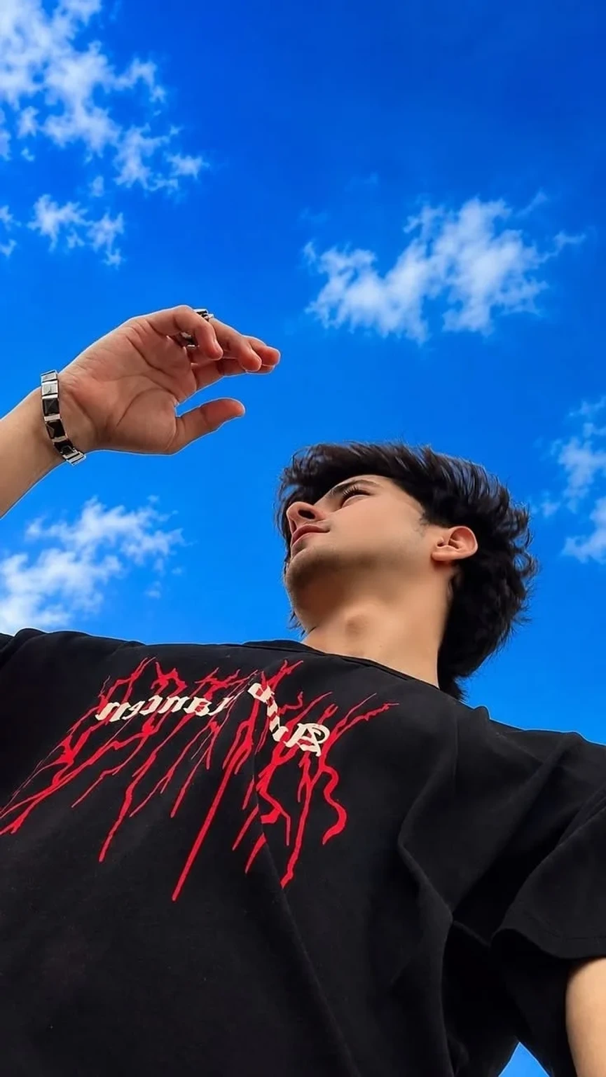 Aesthetic Low-Angle Portrait Under a Vibrant Blue Sky