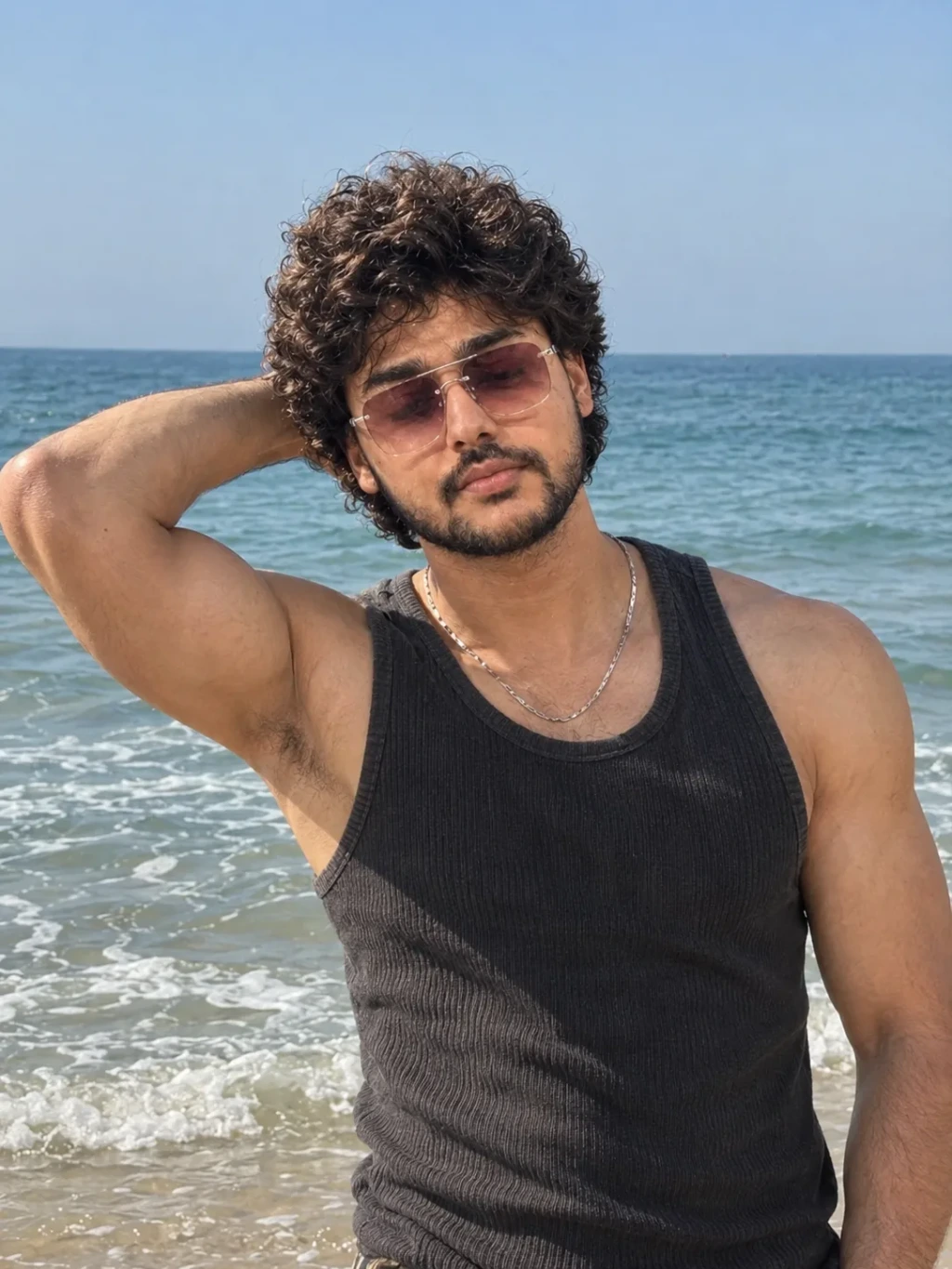 A stylish beach portrait of a young man
