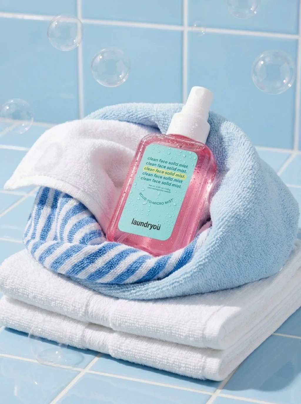 Commercial Product — A translucent pink facial mist spray bottle w