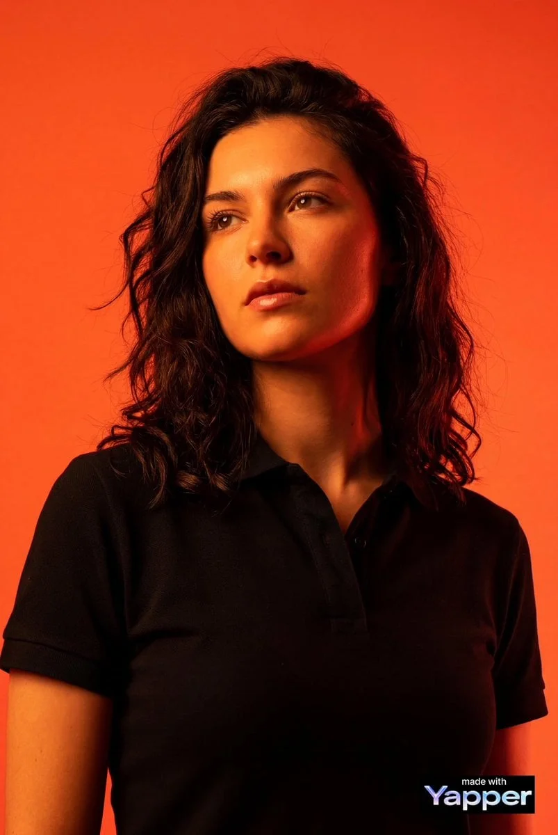 Create a high-impact editorial studio portrait using the