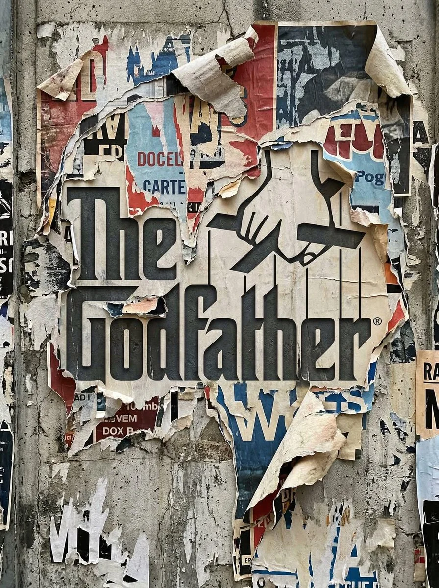 Transform the uploaded logo into a realistic urban wall